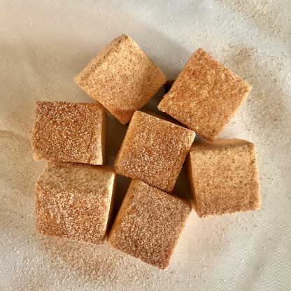 A pile of Apple Cider Donut Marshmallows on a white cloth.