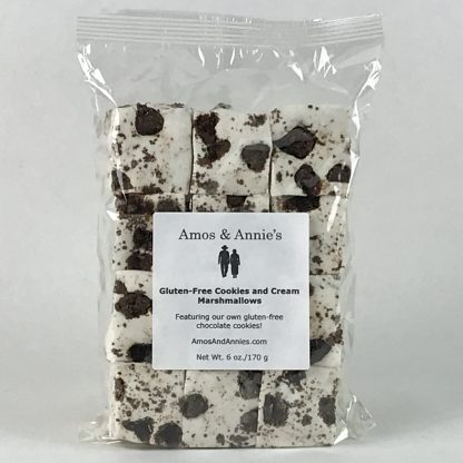 Twelve gluten-free cookies and cream marshmallows in a clear bag setting on a white background
