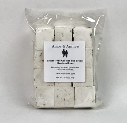 Twelve gluten-free cookies and cream marshmallows in a clear bag setting on a white background
