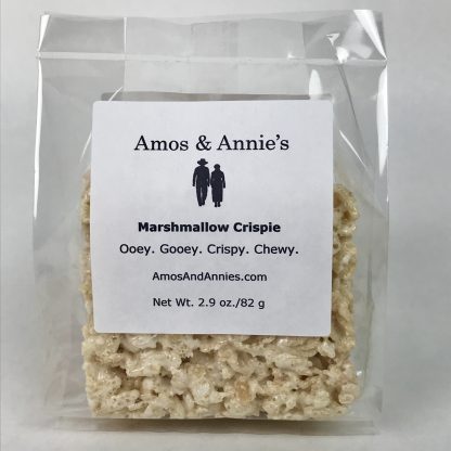 A Marshmallow Crispie is packaged in a clear bag with the Amos and Annie's label on the front.