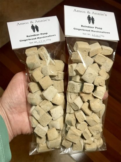 Miniature gingerbread marshmallows are packaged in slim cellophane bags. A white card is attached to the top of the bags identifying the flavor of the marshmallows. They are also given the cute name of "reindeer poop".